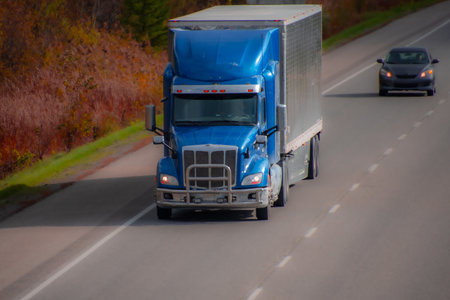 Heavy truck on a Canadian highway in the fall in Quebecの写真素材
