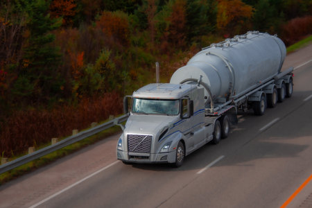 Heavy truck on a highway in the fall