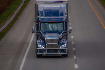 Heavy truck on a Canadian highway in the fall in Quebecの写真素材