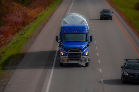 Heavy truck on a Canadian highway in the fall in Quebecの写真素材