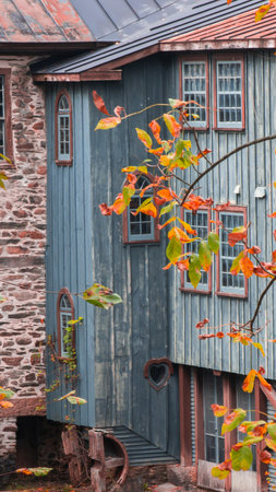 Old abandoned mill, forgotten in the heart of the Canadian forest in autumnの写真素材