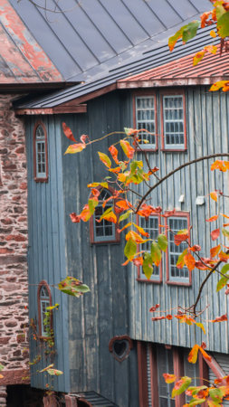 Old abandoned mill, forgotten in the heart of the Canadian forest in autumn