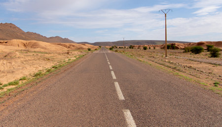 Long road through the Moroccan desert along the Atlas Mountainsの写真素材