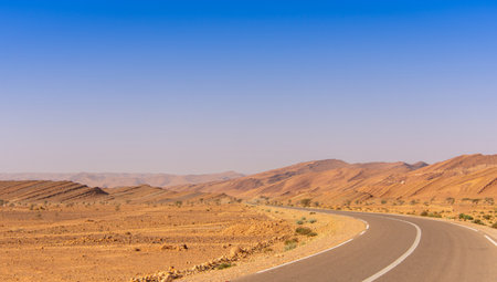Long road through the Moroccan desert along the Atlas Mountainsの写真素材