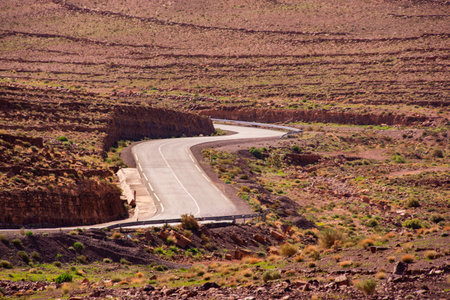 Long road through the Moroccan desert along the Atlas Mountainsの写真素材