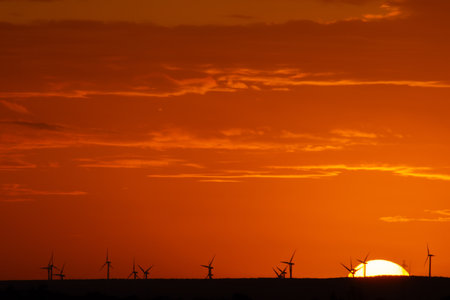 sunset behind the wind turbines in the Essaouira region in Moroccoの写真素材