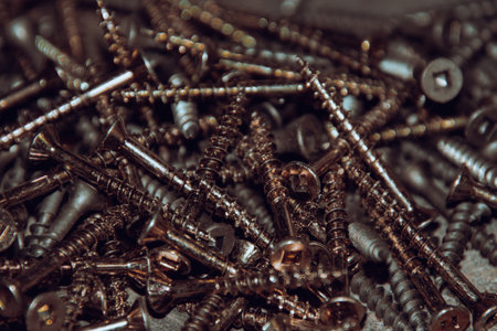 Wood screws lying around on the workbench in a corner of the houseの写真素材