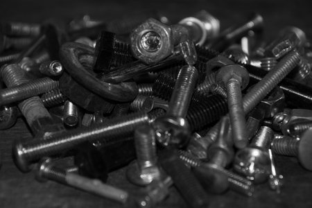Group of bolts left on the workbench in the basement of the houseの写真素材
