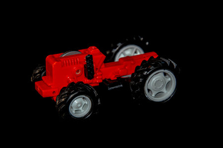 Small children's toys, miniature vehicles isolated on the floor of the houseの写真素材