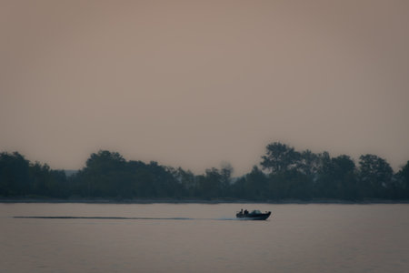 Misty morning at sunrise on a fishing lake in the Canadian forest of Quebec
