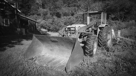 Old tractor on a farm in the Canadian countryside of Quebec