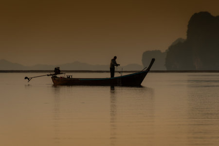 Fishermen in their small boats in the famous Phang Khao Lak bay in southern Thailand