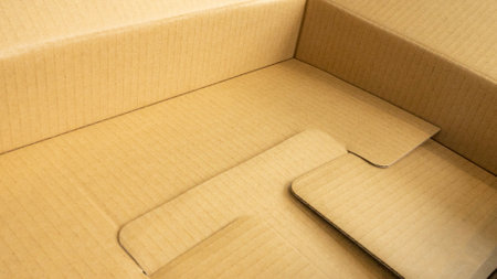 Close up of cardboard box and mobile phone with copy space for your textの写真素材