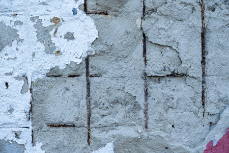 Texture of old concrete wall with rusty fittings
