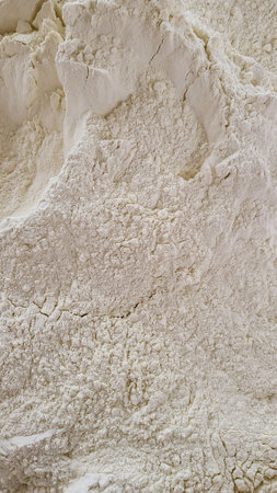 Close-up of white flour in the bakery. Food background.の写真素材