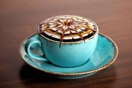 delicious caramel coffee on the wooden desk