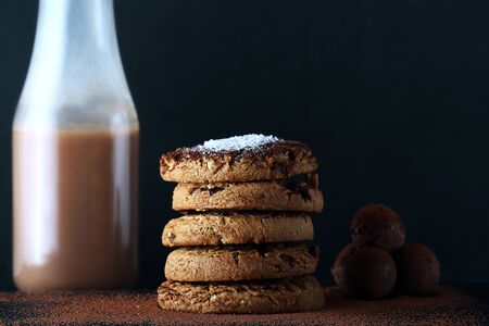 Chocolate cookies on wooden table. Chocolate chip cookies shot