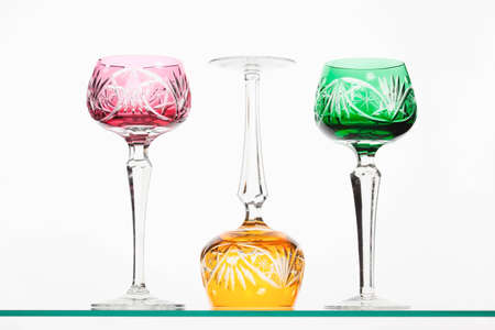 Red, green and yellow crystal wineglassesの写真素材