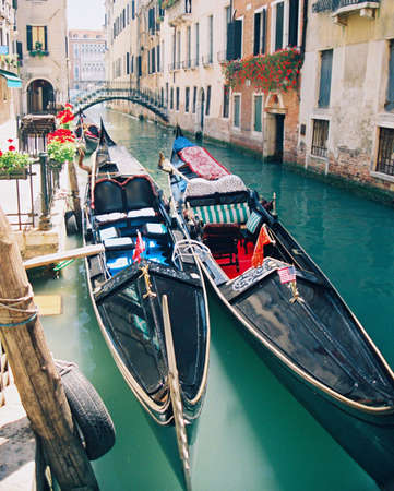 Gondolas moored in Venice Italys waterwaysの写真素材