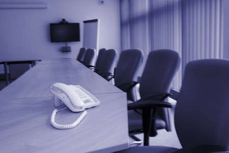 Telephone on desk in conference room of big companyの写真素材