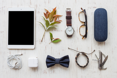 Flat lay, Men's accessories with tablet on white wooden board backgroundの写真素材