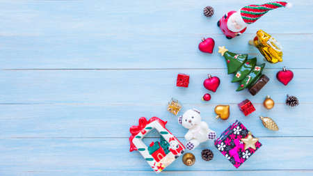 Christmas and Happy New Year holidays with decoration items on blue rustic wooden backgroundの写真素材
