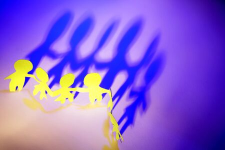 Paper dolls and shadowsの写真素材