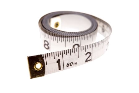 Measuring tape coiled isolated over white