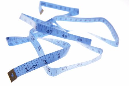Measuring tape over white