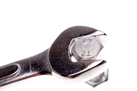Spanner and nut over whiteの写真素材