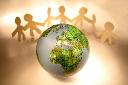 Team holding hands and globe