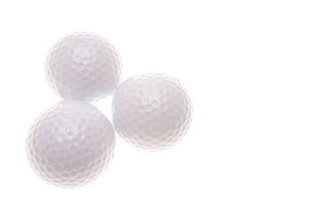 Three golf balls over whiteの写真素材