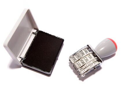 Date stamp and pad on whiteの写真素材