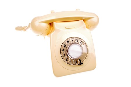 Rotary dial telephone on whiteの写真素材