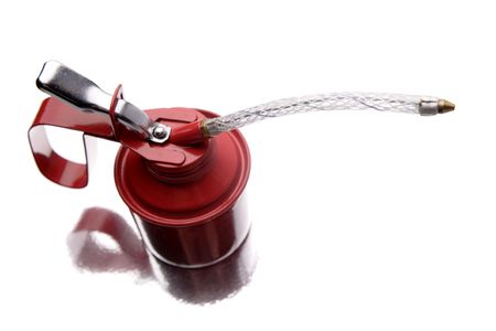 Red oil can over white