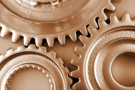 Closeup of three gearsの写真素材