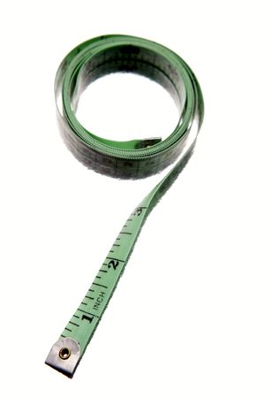 Tape measure rolled on white backgroundの写真素材