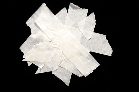 Pieces of masking tape on black の写真素材