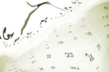 Clock face blending into calendar.の写真素材
