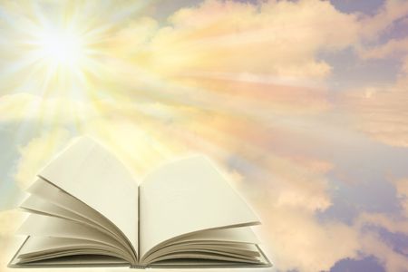 Open book on a heavenly scene. Copy space.  の写真素材