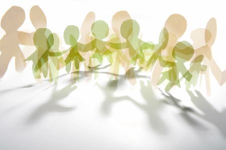 Paper doll cutouts symbolising overcrowding or unity.の写真素材