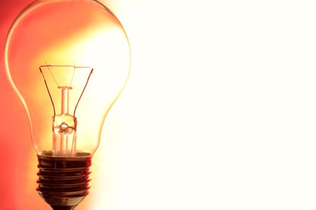 Clear light bulb closeup. Space for copy.