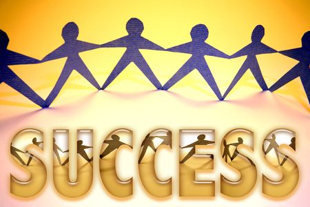 Papaer doll team holding hands.の写真素材