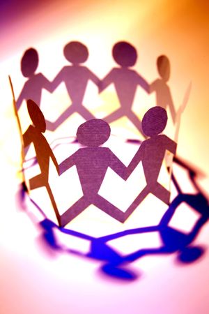 Paper doll people holding hands in a circle.の写真素材