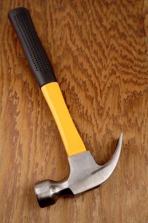 Claw hammer on wooden panel   の写真素材