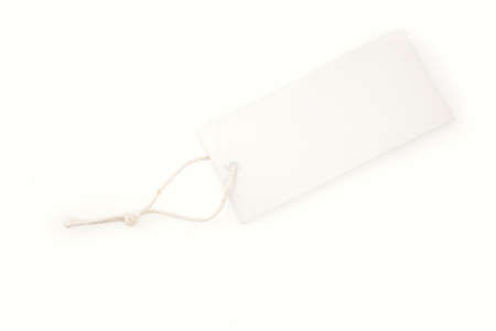 Tag and string on plain background