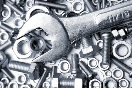 Chrome wrench on nuts and boltsの写真素材