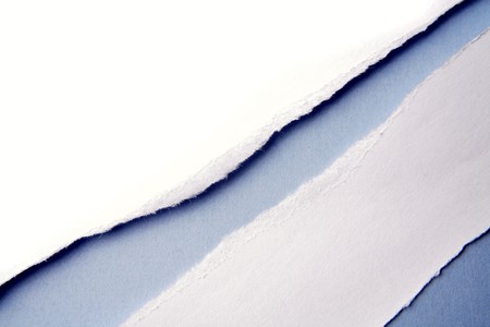 Ripped  paper on blue background の写真素材