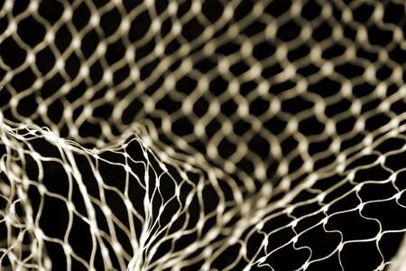 Close-up of netting on black backgroundの写真素材