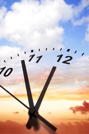 Clock face on sky background